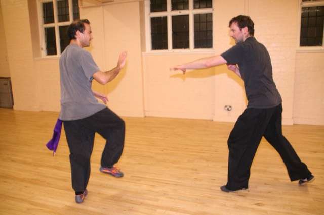 Two students practising a hand technique