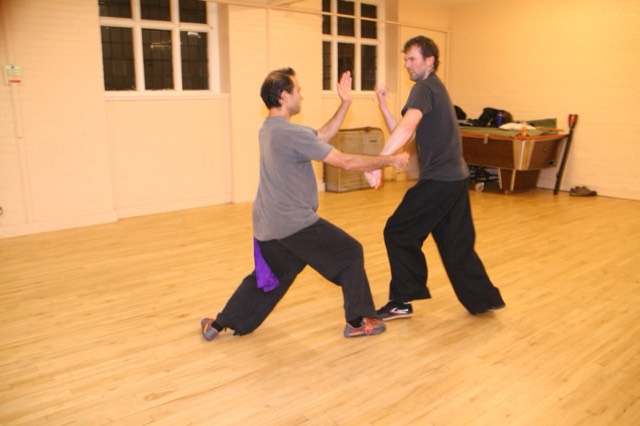 Two students in sensing hands practice