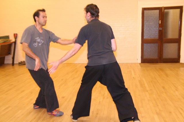 Two students practising push hands